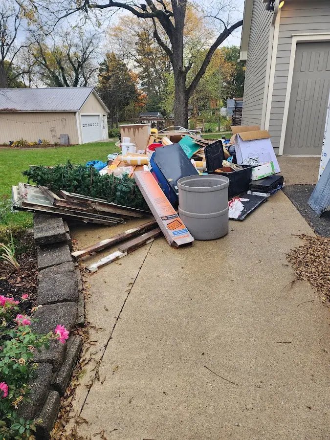 Dumpster being loaded with debris for Roofing Dumpster Rental in Coventry